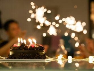 Asian family having fun celebrate happy birthday anniversary party at home