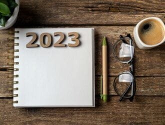 New year resolutions 2023 on desk. Wooden eco friendly reusable new year decorations 2023