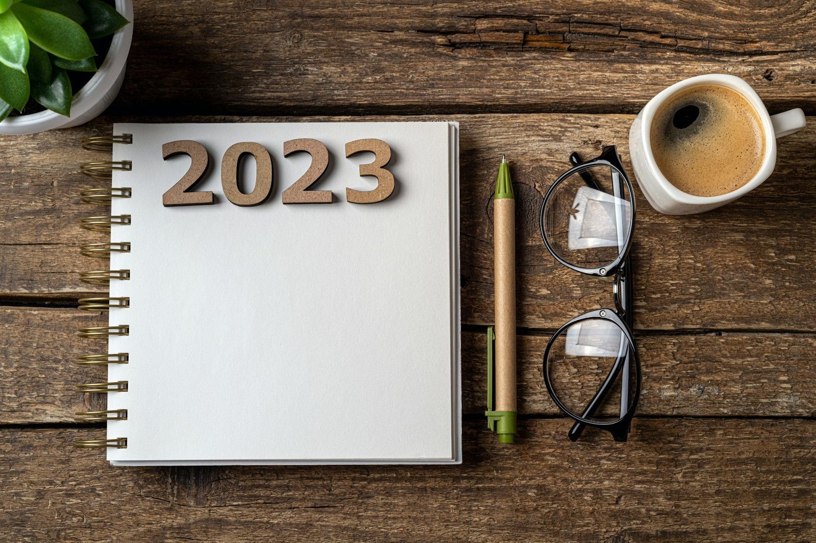 New year resolutions 2023 on desk. Wooden eco friendly reusable new year decorations 2023