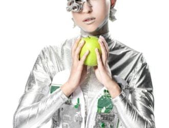 silver robot holding apple and looking at camera isolated on white, future technology concept
