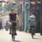 Tourist riding bicycle in old town in Vietnam